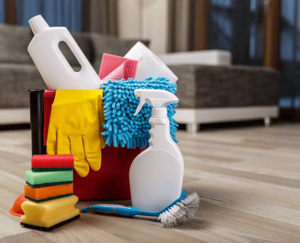 Cleaner disinfecting bathroom tiles and fixtures in a Dubai apartment