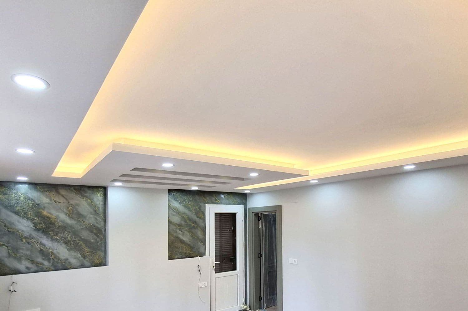 Close-up of a decorative gypsum ceiling with intricate moldings.