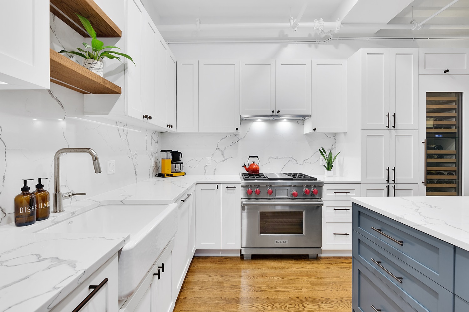 Stylish kitchen with contemporary lighting and spacious countertops.