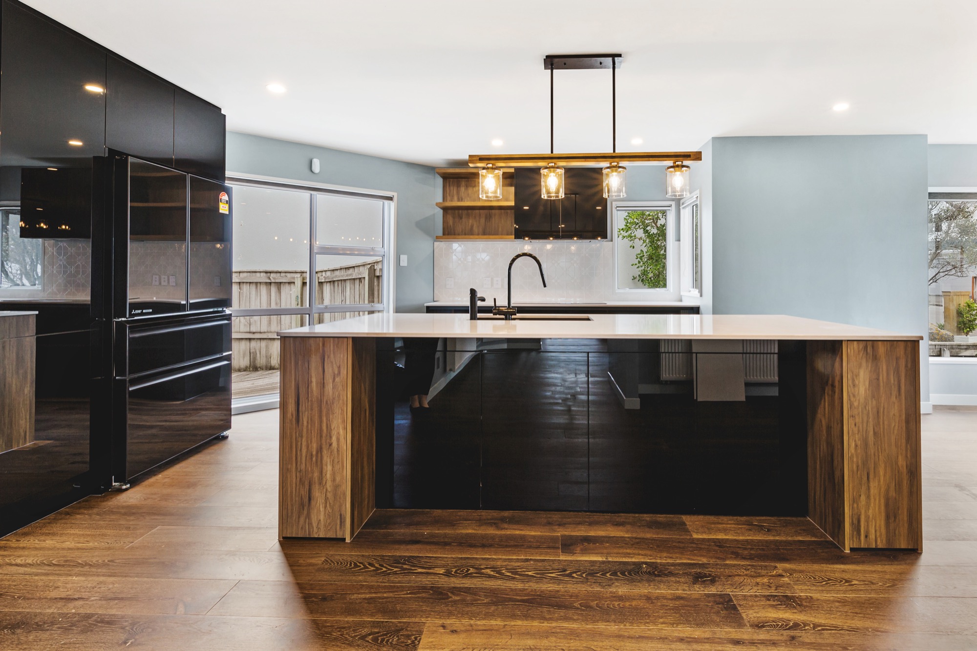 Team installing custom cabinetry in a Dubai home kitchen.