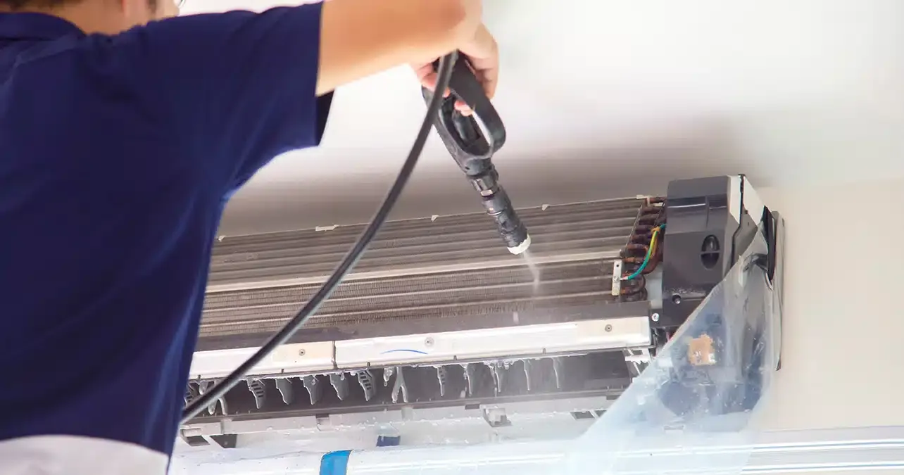 Homeowner observing AC coil cleaning for better energy efficiency